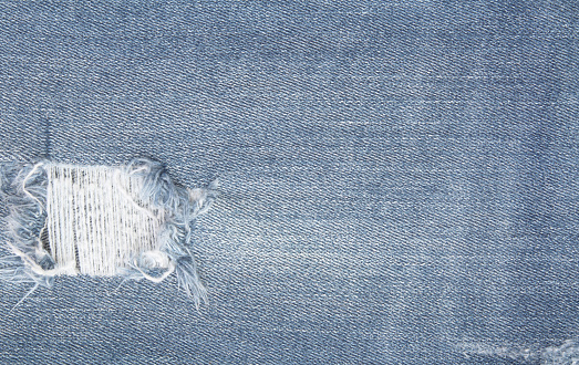 Blue jean texture background, pattern of denim in old and tear.