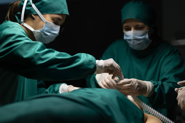 istock Medical team performing surgery in operation room. 1460992176