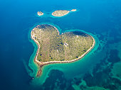 Aerial drone view of Galesnjak the Island of Love in Croatia with beautiful blue turquoise sea water