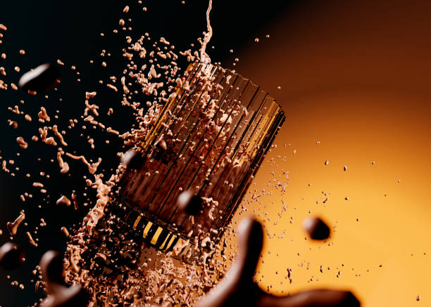 Chocolate milk poured into ribbed levitating glass. Spillage, drops and milk flying everywhere.