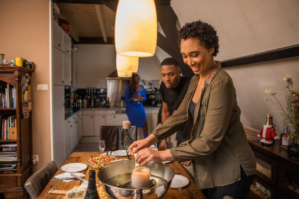 istock Black woman setting the table at a dinner party celebration 1460996783