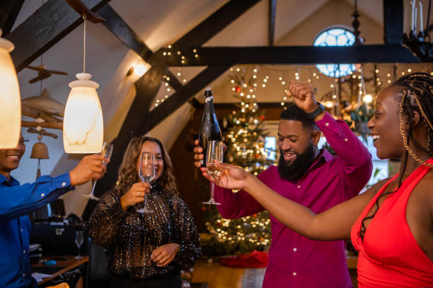 istock Black friends toasting at a dinner party celebration 1460997741