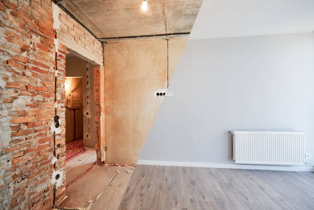 istock Living room with heating radiator before and after renovation. 1460997824