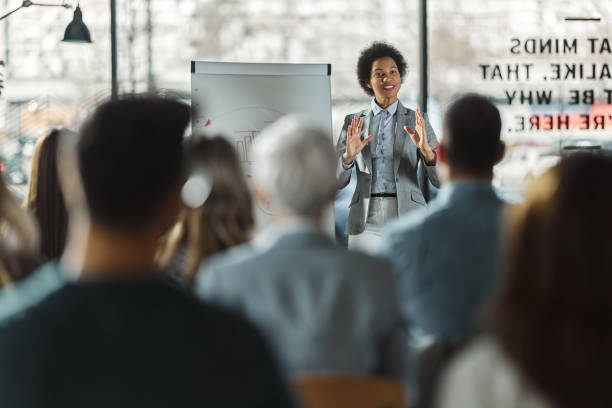 istock Happy black leader talking on presentation in the office. 1460998653