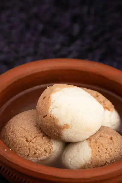 Photo of Indian Mithai Chocolate Rasgulla Also Called Choco Gulla, Rasagola, Rosgola, Roshogolla, Rossogolla, Rasbhari Or Rasbari Is Ball Shaped Dumpling Made Of Chhena, Sugar Syrup, Chena, Panir ,Paneer