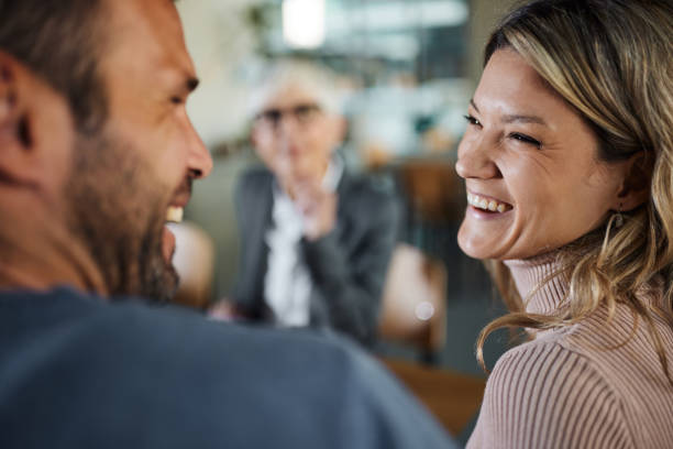 istock Happy couple talking while having a meeting with advisor. 1460999257