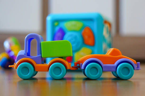 istock Selective focus shot of plastic colorful cars isolated on a reflective surface 1461001245