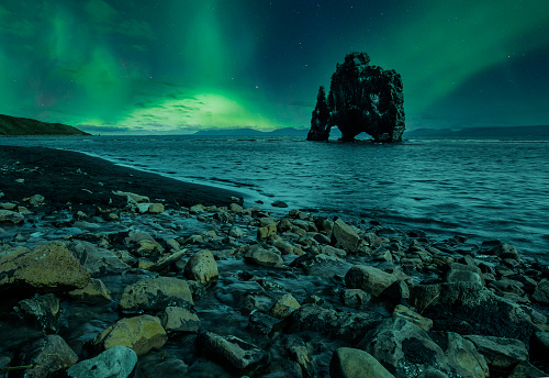 The Hvitserkur landscape at night with beautiful northern lights in Iceland