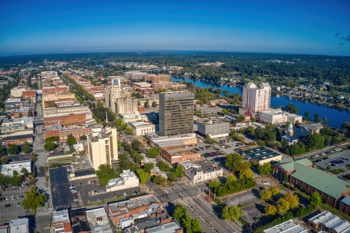 A beautiful aerial view of Downtown Augusta with dense buildings under a blue clear sky in Georgia