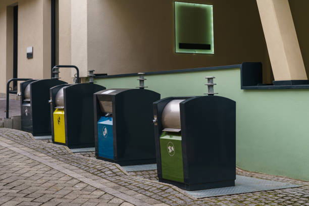 istock Stylish metal trash containers near the building 1461002881