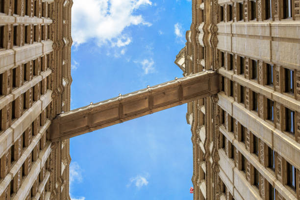 A low angle shot of two buildings on the blue sky background