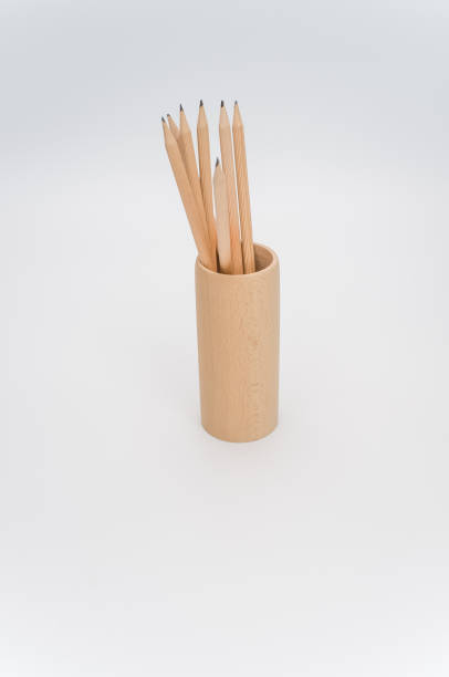 istock wooden pen holder with pencils on a white background 1461004563
