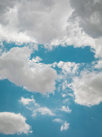 A relaxing view of cotton-like clouds in a blue sky
