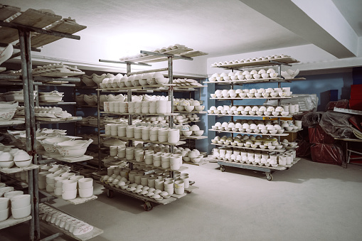 Untreated ceramic on the shelves at the porcelain factory in Vietnam