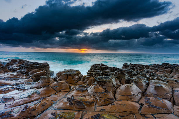 istock Seashore of the tranquil sea under a sunset sky 1461007337