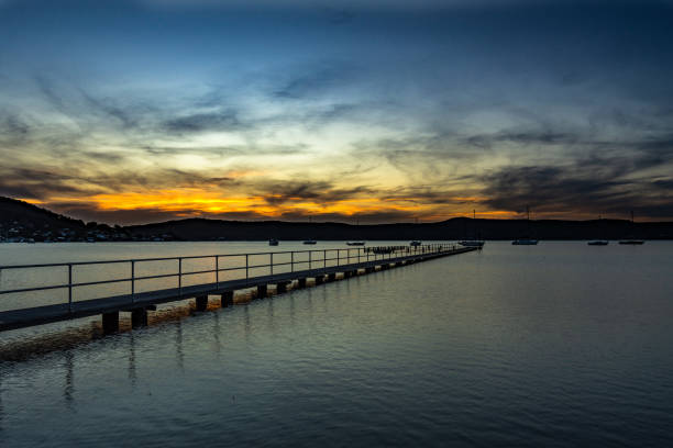 istock Seashore of the tranquil sea under a sunset sky 1461007354