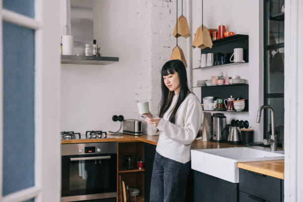 istock Japanese woman using smartphone at home 1461007866