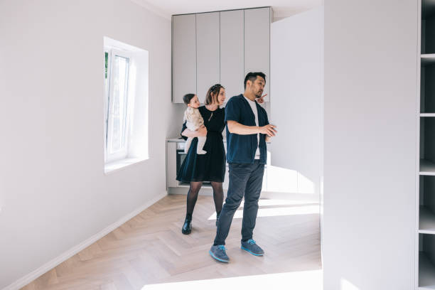 istock Young family looking at potential new home 1461009959