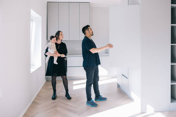 istock Young family looking at potential new home 1461009997