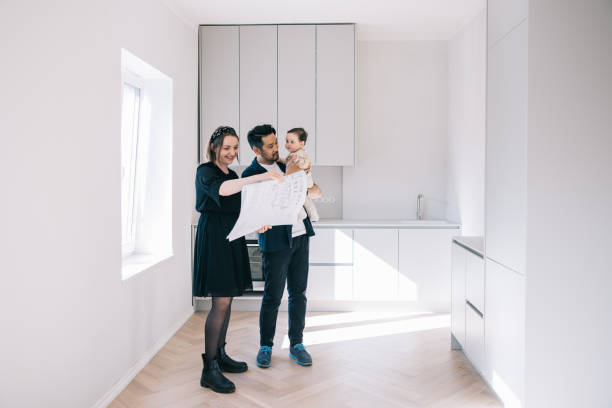 istock Young family looking at potential new home 1461010000
