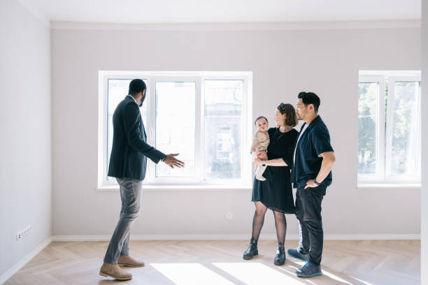 istock Real Estate AGent giving home tour for potential clients. 1461010228