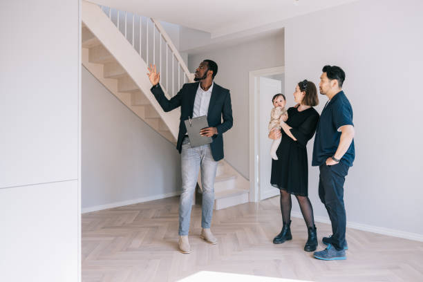 istock Real Estate AGent giving home tour for potential clients. 1461010237