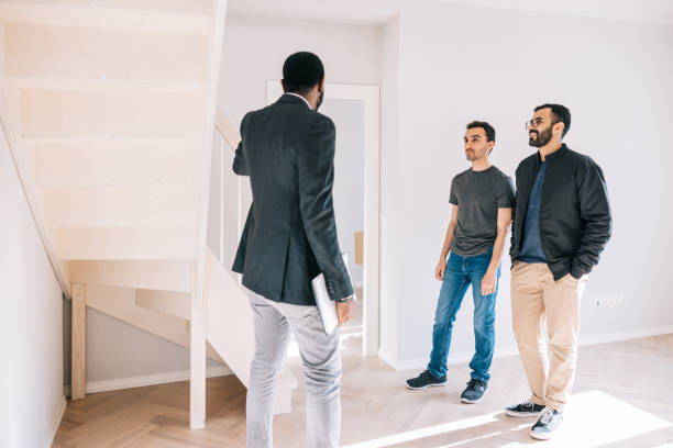 istock Real Estate AGent giving house tour for potential clients 1461010796