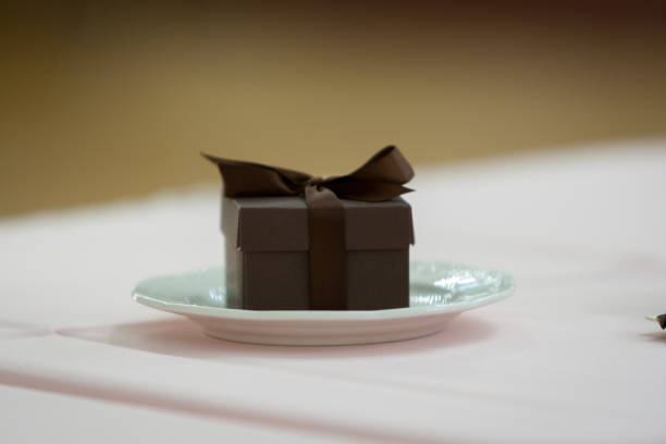 A closeup shot of a small brown gift box on a pla