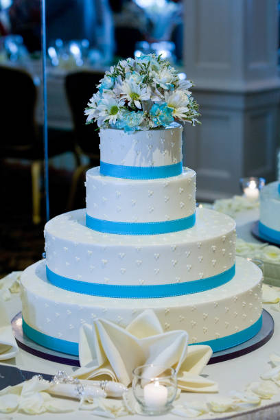 istock Vertical shot of a blue and white cake on a wedding table 1461010876