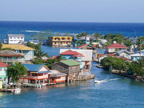 An aerial view of many houses along the canal on Roatan Island in summer