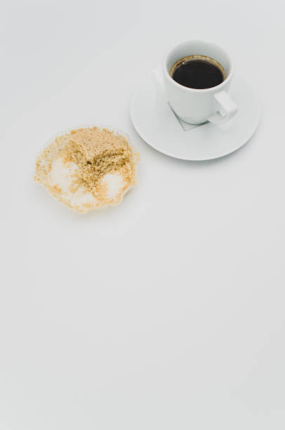 istock white stoneware strong espresso coffee cup and nibbled cupcake o 1461013199