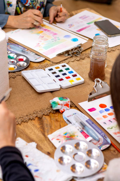 istock Watercolor painting workshop. General view of the work table with watercolors and tools. 1461014079