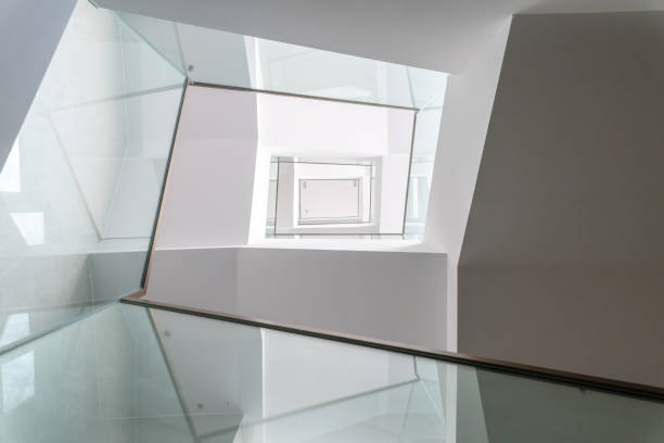 istock Low-angle view of stairs in a modern office building 1461014409