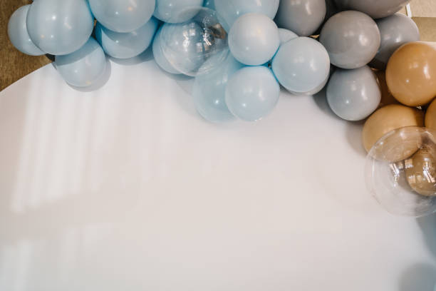 istock Details. Photo-wall decoration space, place for text on white background. Arch decorated with blue, brown, grey balloons. Wedding reception. Trendy decor. Celebration baptism concept. Birthday party. 1461019409