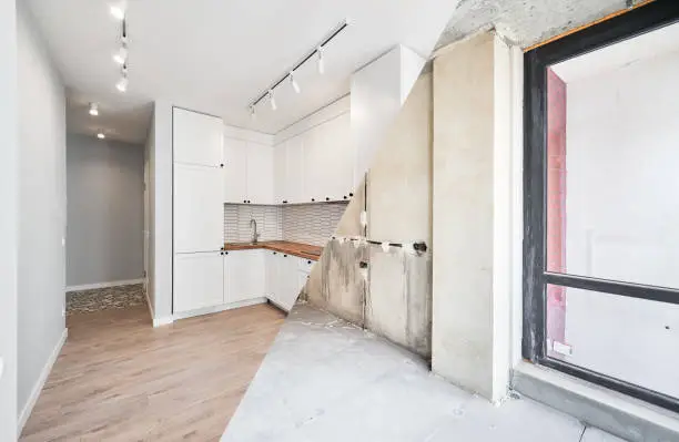 Photo of Comparison of kitchen room before and after renovation.