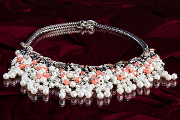 istock Beautiful elegant gem necklace on the red fabric 1461020116
