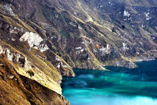 View of a water-filled crater lake and the most western volcano in the Ecuadorian Andes