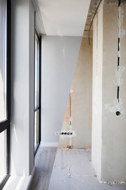 istock Apartment with large windows before and after renovation. 1461022075