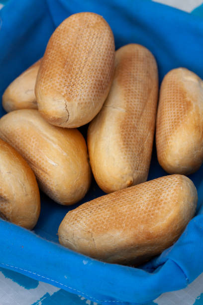 istock Selective of bread loafs in a blue basket 1461024333