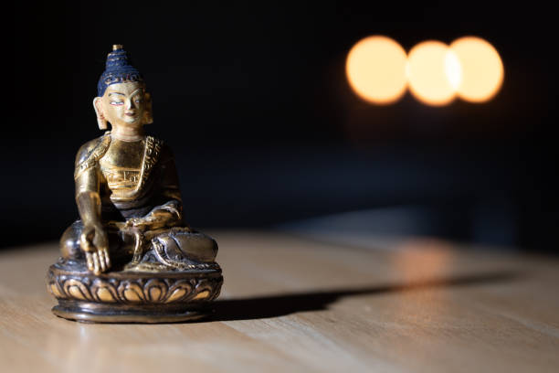 istock Closeup shot of a small Buddha statue on the table 1461025196