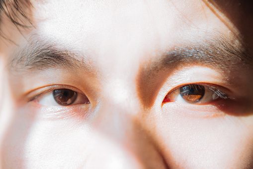 Male eyes close-up isolated on white background