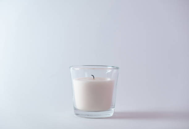 istock Closeup of a scented candle against a white wall 1461025873