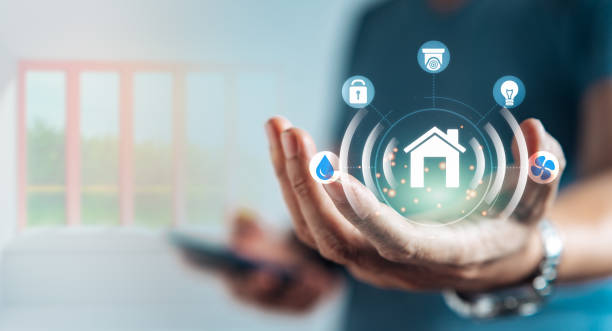 istock User holding virtual icons on display screen as a assistant remote from house with copy space 1461027940