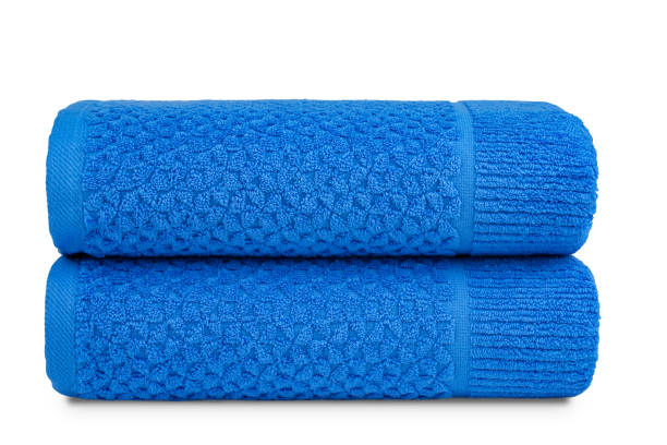 istock multicolored terry towels, rolled up and stacked on the table 1461030166