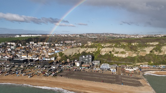 Rainbow over Hastings seaside town and beach Kent coast of England drone aerial view