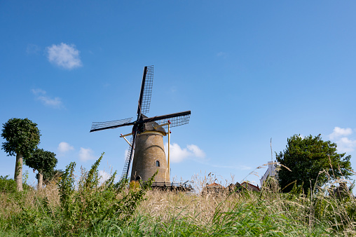 The mill De Hoop is a mill built in 1853 and in use as a corn mill peeling mill and oil mill in the Dutch village of Oldebroek the Netherlands
