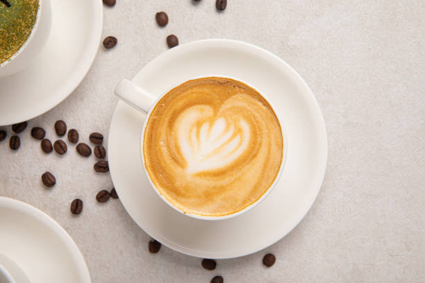istock Cup of cappuccino coffee on the white table 1461036428