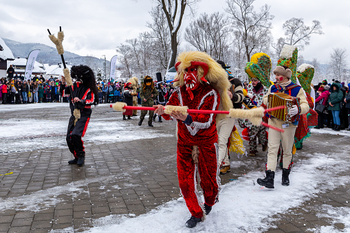 Vitanov, Czech Republic - January 26, 2013: People attend the Masopust Carnival, a traditional ceremonial Shrovetide door-to-door procession in Vitanov near Pardubice, Czech Republic.