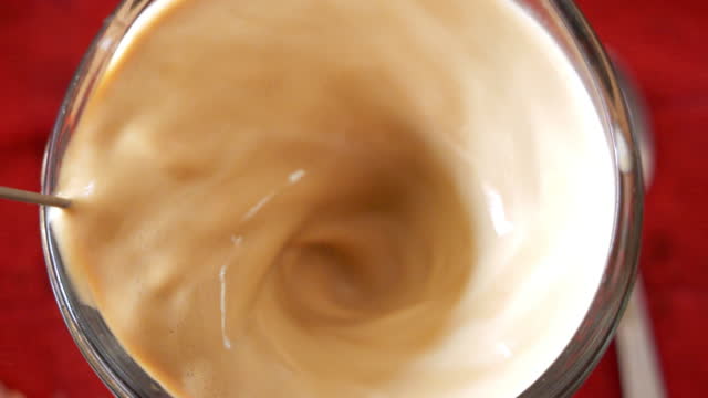 Coffee being brewed in a mug.