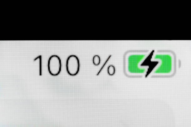 Smartphone full charged pixel battery level indicator - charging process - one hundred, 100 percent: close up, macro of gadget display, screen. Energy, technology, power, digital and symbol concept